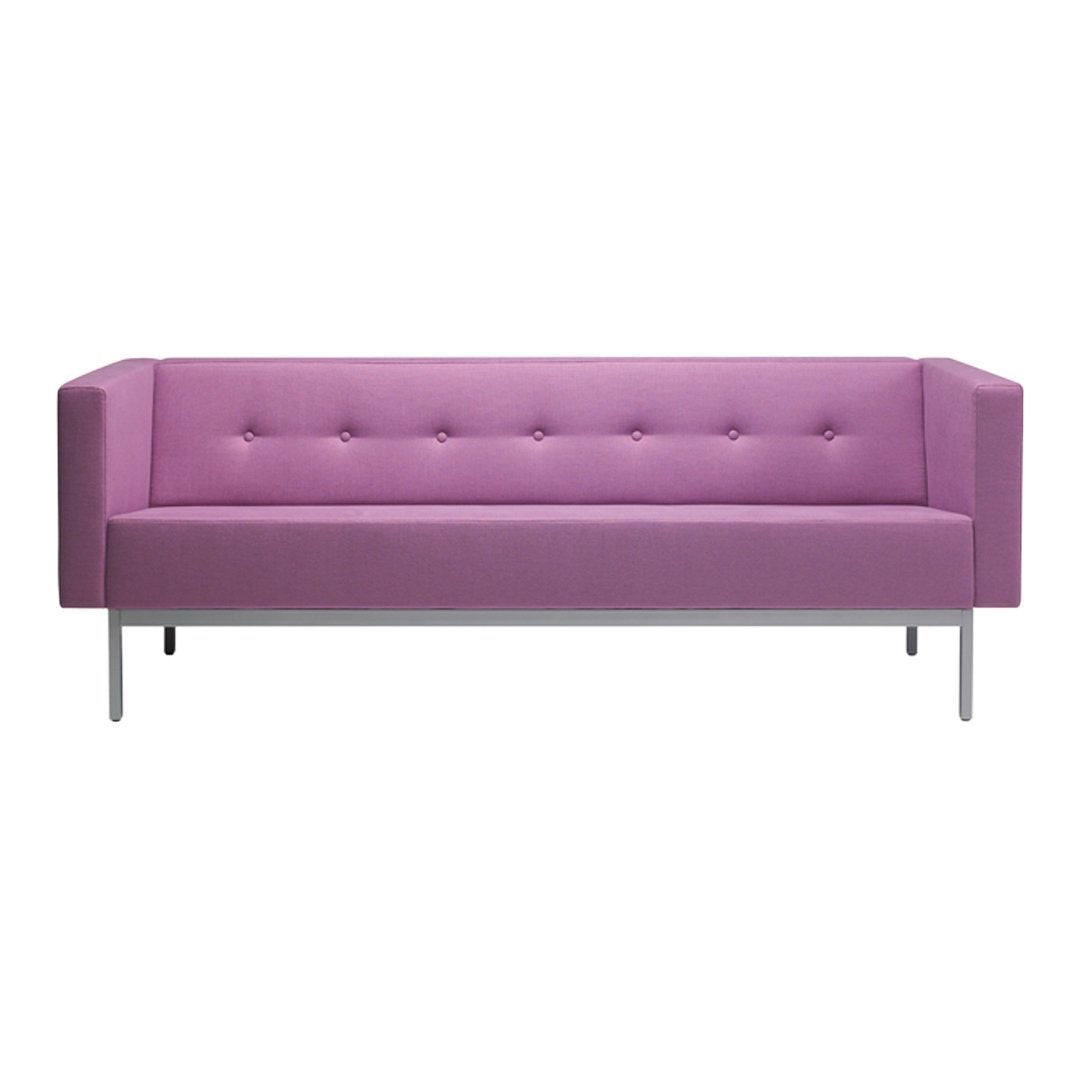Pink tufted sofa with a modern design and sleek metallic legs, ideal for stylish living spaces.