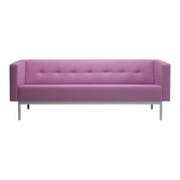 Pink tufted sofa with a modern design and sleek metallic legs, ideal for stylish living spaces.