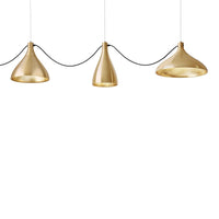 Gold pendant lights in various cone shapes, featuring a sleek, modern design with a black cord.