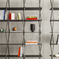 Modern black shelves with alternating matte and glossy finishes against a subtle striped wallpaper background.