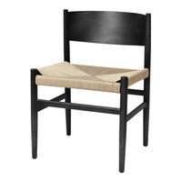 Black wooden chair with a woven beige seat, featuring a minimalist design and natural textures.