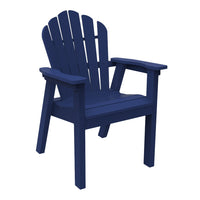 Navy blue Adirondack chair with a classic slatted back and wide armrests, perfect for outdoor relaxation.
