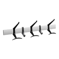 Black hooks on a sleek white rod, creating a modern and minimalist design for versatile storage solutions.