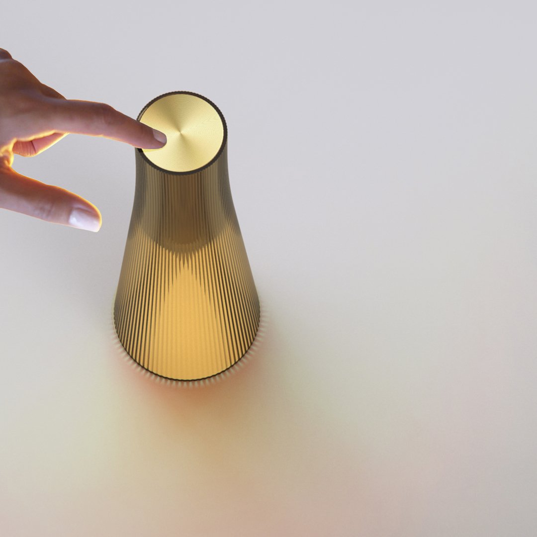 Gold gradient vase with vertical ribbed pattern and a smooth, rounded top. Modern design on a clean, neutral background.