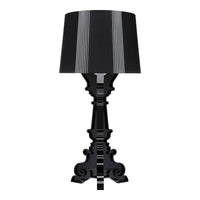 Black ornamental lamp with a black and white striped shade, featuring elegant curves and intricate detailing.