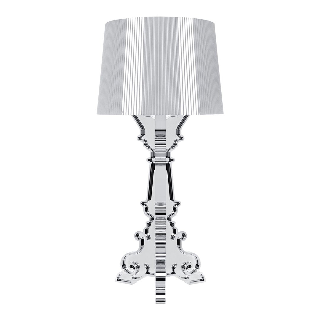 Striped gray and white lampshade atop a glossy black ornate base for a stylish contrast in home decor.