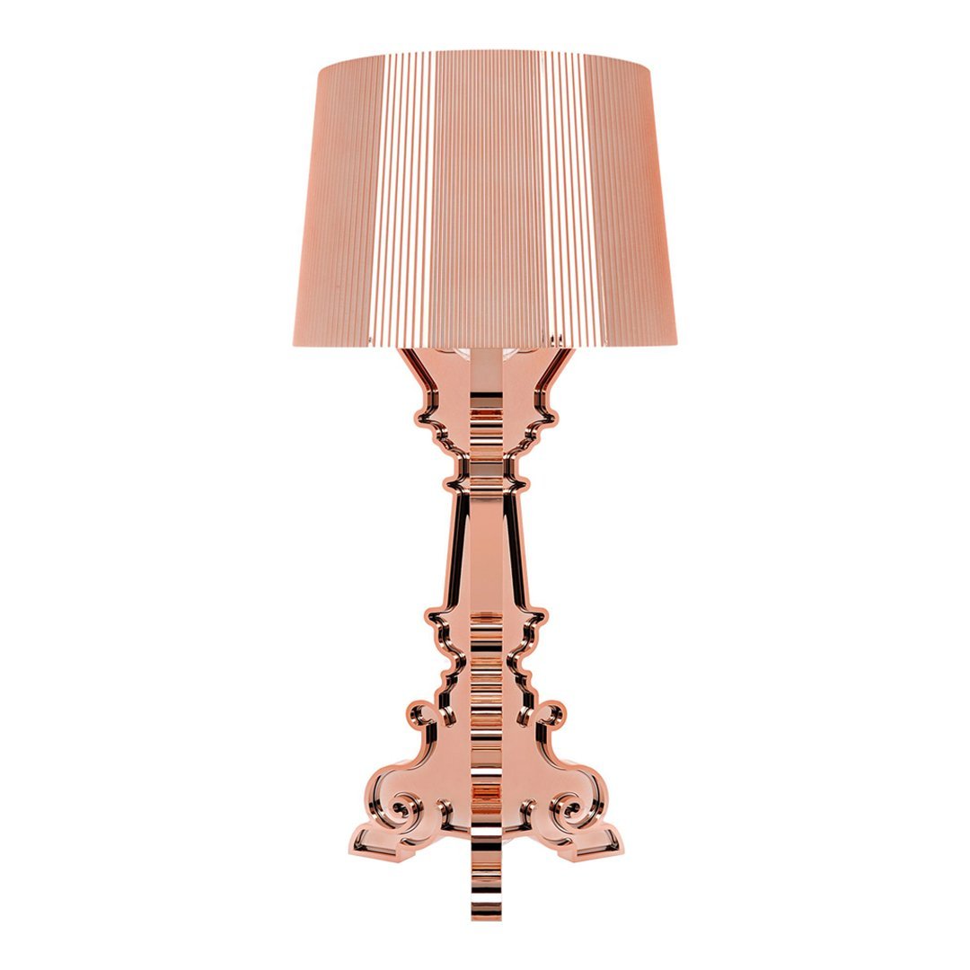 Rose gold lamp with a striped beige and white shade, featuring an ornate base design in a glossy finish.