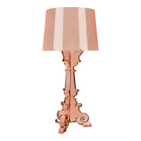 Rose gold lamp with a classic ornate base and a striped beige and white shade. Stylish and elegant design.