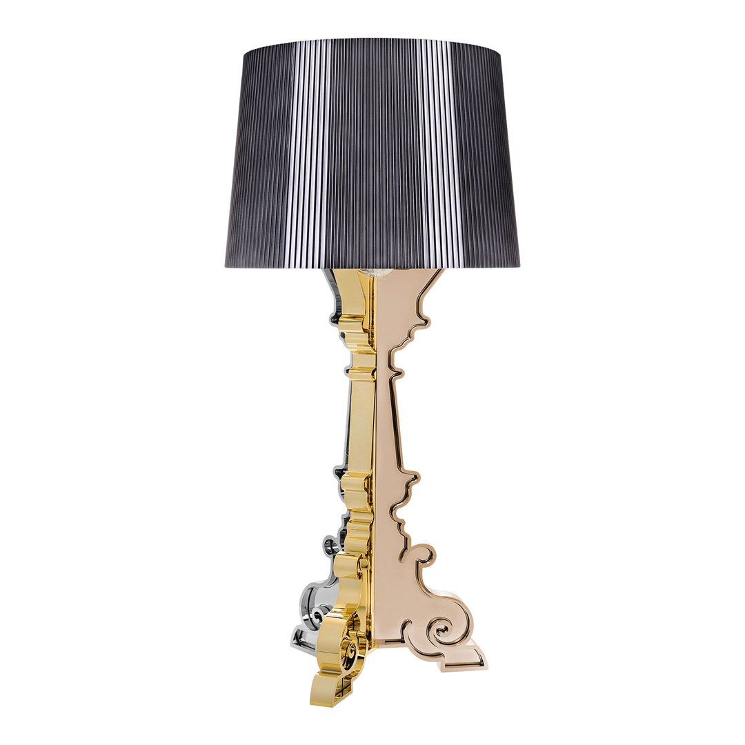 Elegant gold and silver lamp base with a striped black and white lampshade for a striking contrast.