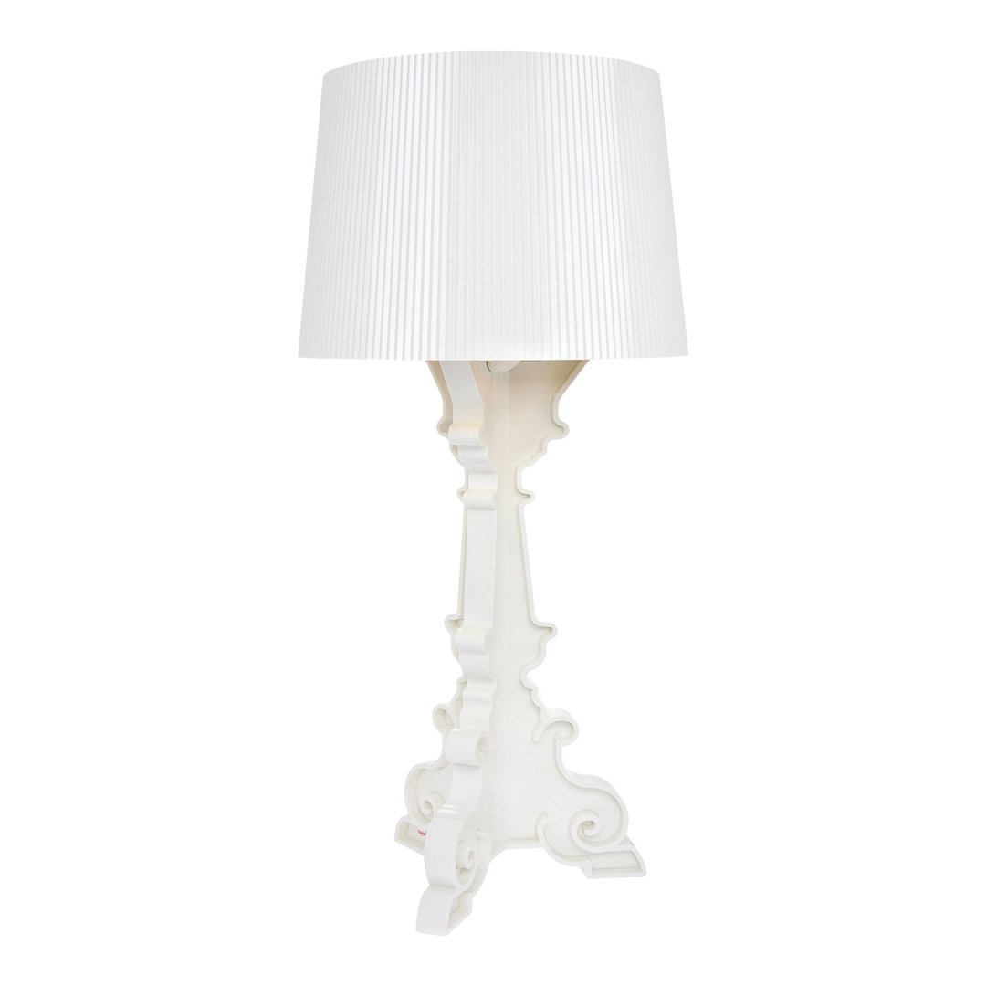 Elegant white lamp with a textured, ribbed shade and ornate base, perfect for modern or classic decor.