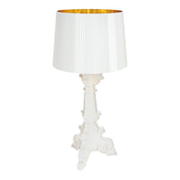 Elegant white lamp with a pleated shade and a sleek, ornate base, featuring a gold interior for added warmth.