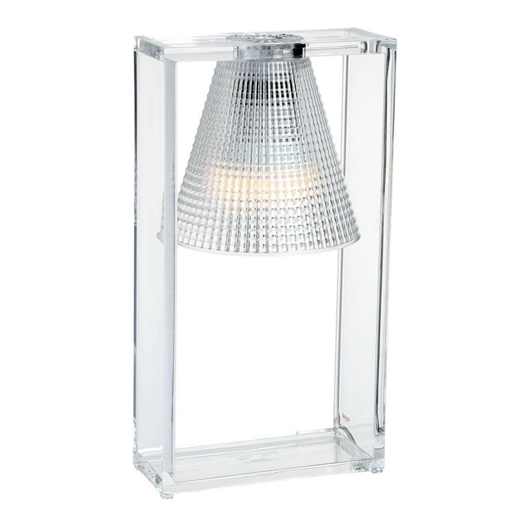 Clear acrylic table lamp with a textured silver shade, featuring a modern geometric pattern.