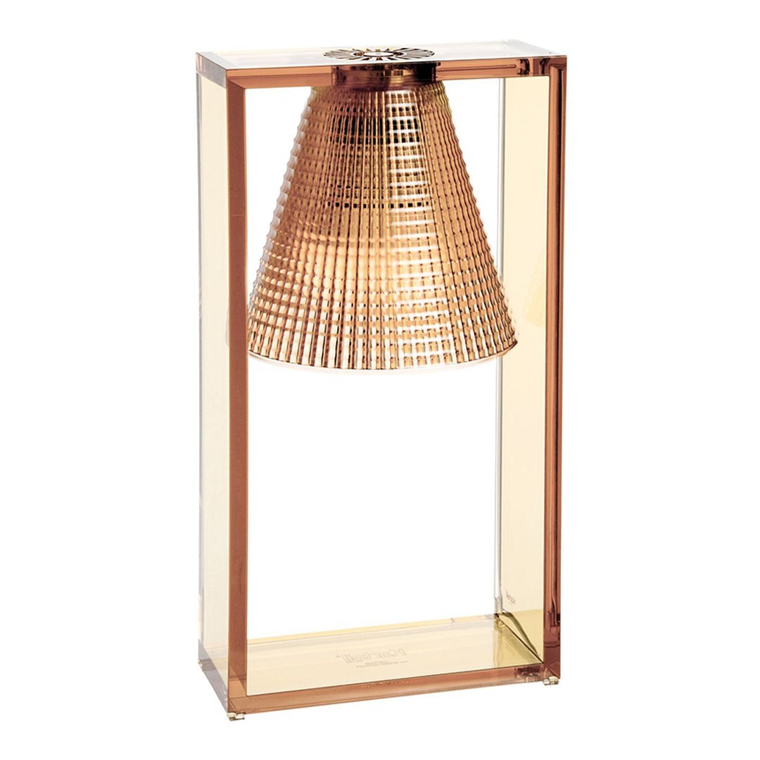 Metallic copper lamp with a textured cone shade, set in a clear rectangular frame. Elegant and modern design.