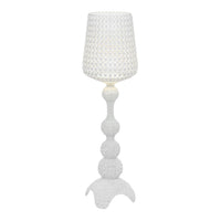 White patterned lamp with a textured shade and sculptural base, ideal for modern decor.