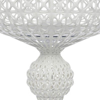 White decorative bowl with intricate geometric patterns and a textured finish. Elegant and modern design.