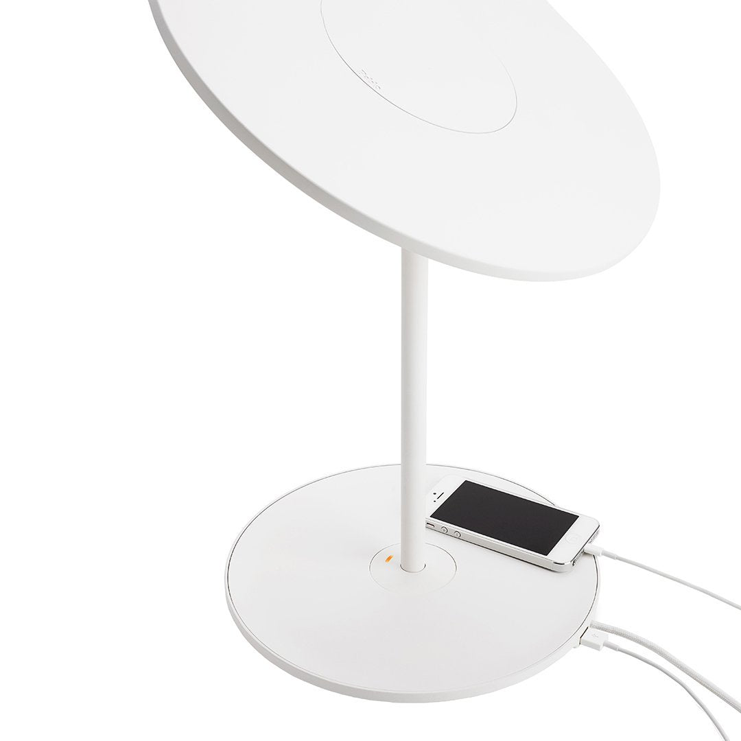 White modern desk lamp with a sleek circular shade and base, featuring minimalist design for a contemporary look.