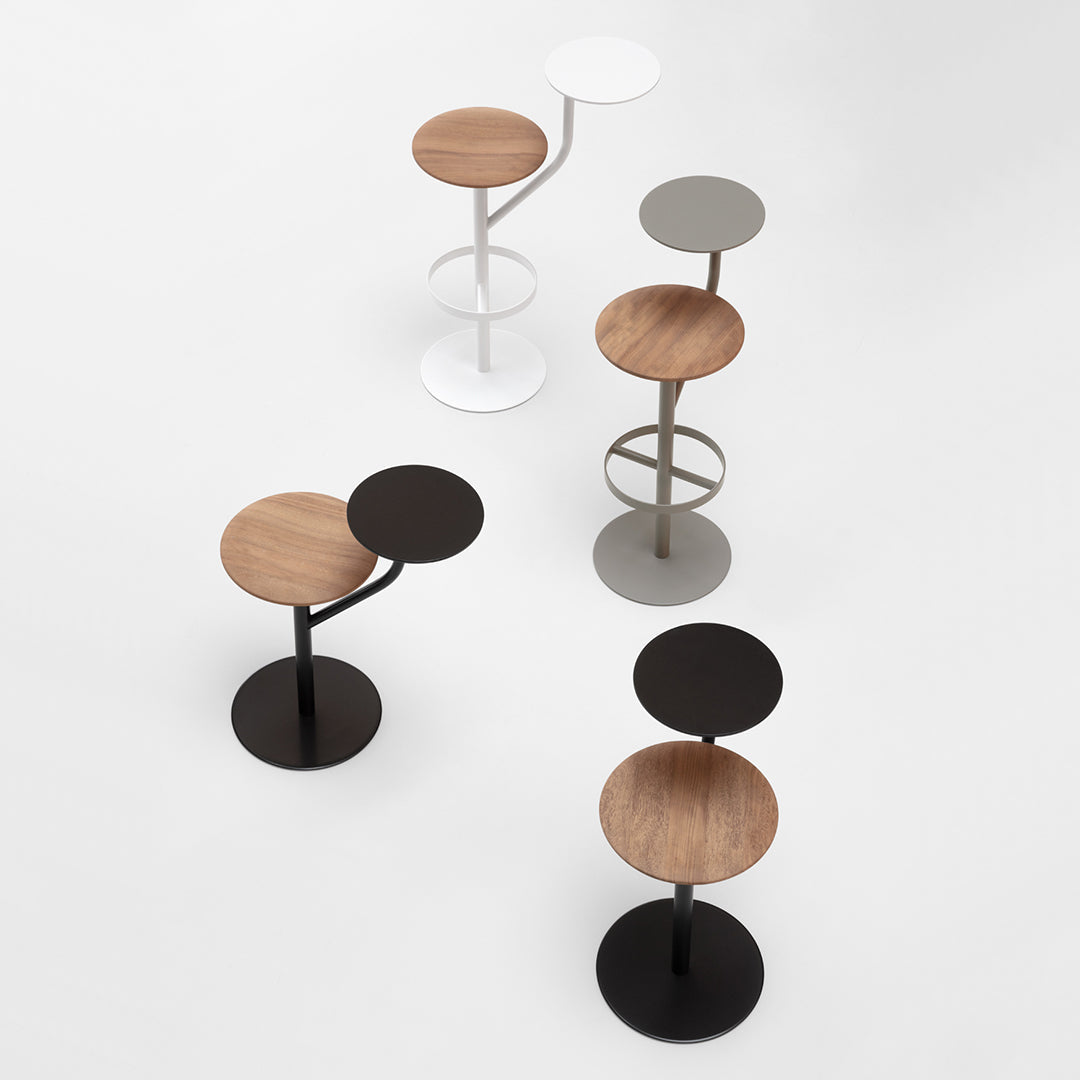 Set of modern stools featuring wood and metal finishes in black, white, gray, and natural wood tones against a clean background.