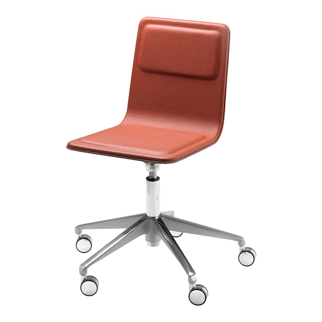 Rust orange ergonomic office chair with sleek silver base and smooth rolling casters. Minimalist design for modern spaces.