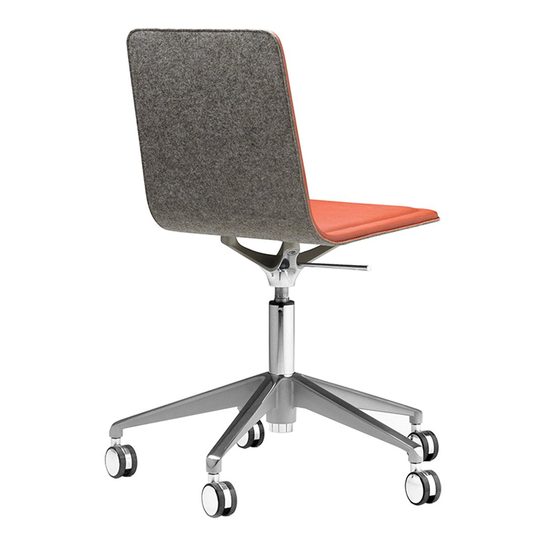 Orange leather seat with a grey fabric backrest, sleek chrome base, and rolling wheels on a modern office chair.