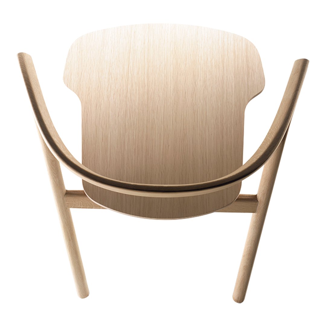 Light wood chair with a smooth, natural finish and curved lines, showcasing minimalist design and organic patterns.