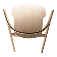 Light wood chair with a smooth, natural finish and curved lines, showcasing minimalist design and organic patterns.