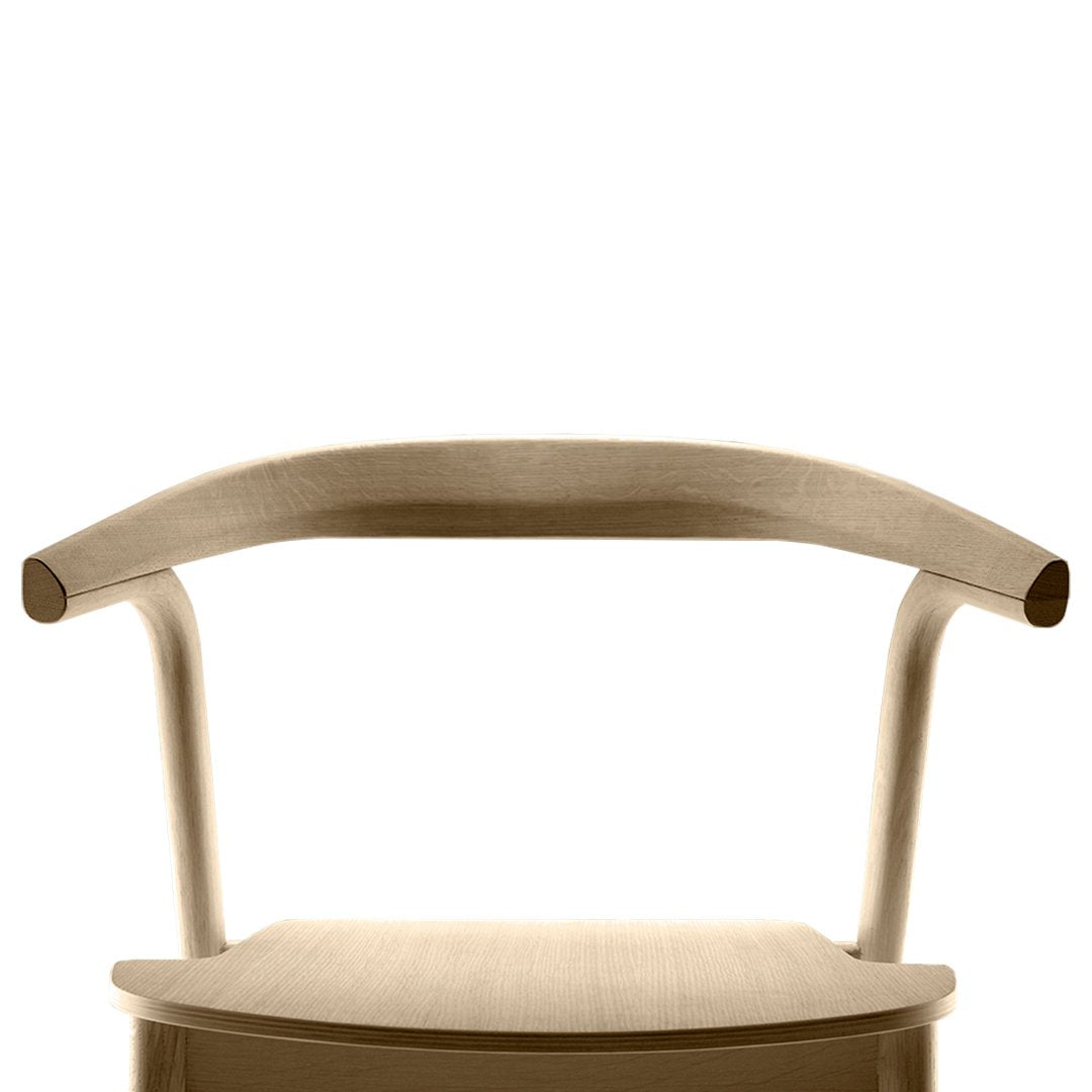 Natural wood chair with a minimalist design, featuring smooth curves and a light beige finish.