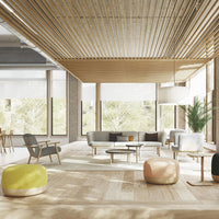 Modern living room featuring neutral gray and beige furniture, colorful poufs in yellow and pink, and natural wood accents.