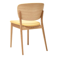 Light wood dining chair with a smooth finish and a soft yellow cushioned seat, showcasing a minimalist design.
