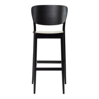 Stylish black wire chairs with geometric patterns casting shadows on a light gray surface. Modern outdoor furniture design.
