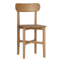 Natural oak wood chair with a smooth finish and minimalist design. Features warm, light brown tones.