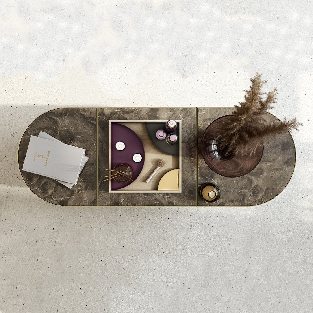 Stylish coffee table featuring a marbled gray finish with geometric patterns in purple, yellow, and white.
