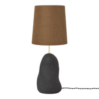 Stylish lamp featuring a textured brown shade and a smooth, dark gray base for modern decor.