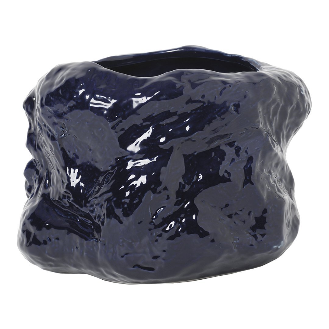 Glossy navy blue ceramic vase with an organic, textured surface for a modern, artistic touch.
