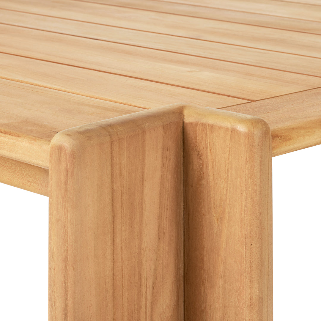 Natural wood texture with warm beige tones and smooth, clean lines on a modern table design.