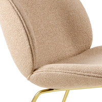 Beige textured upholstery with a soft, cozy finish, complemented by a sleek gold base. Perfect for modern decor.