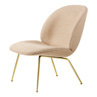 Beige upholstered chair with smooth curves and bold gold legs, featuring a minimalist modern design.