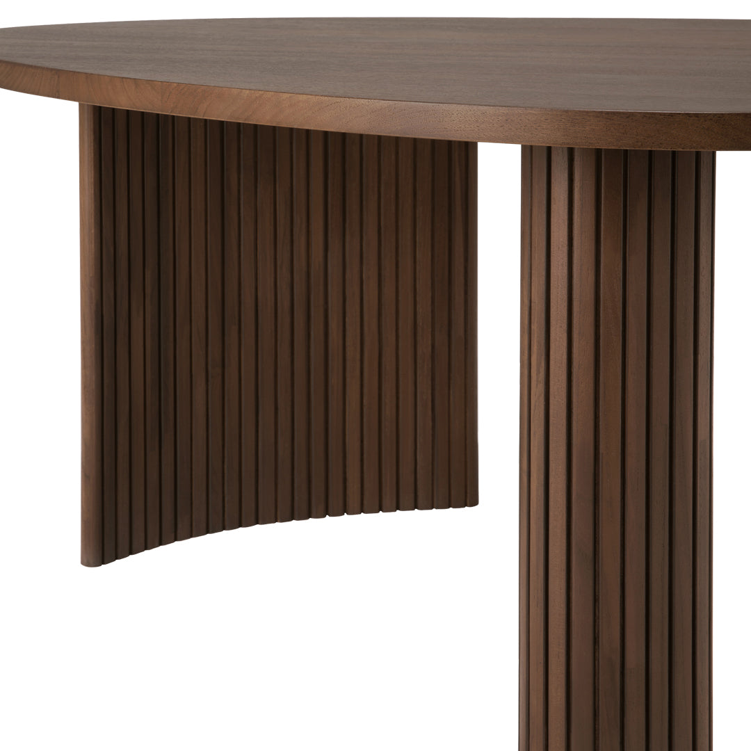 Brown round table with vertical wood grain pattern and curved design. Elegant and modern finish.