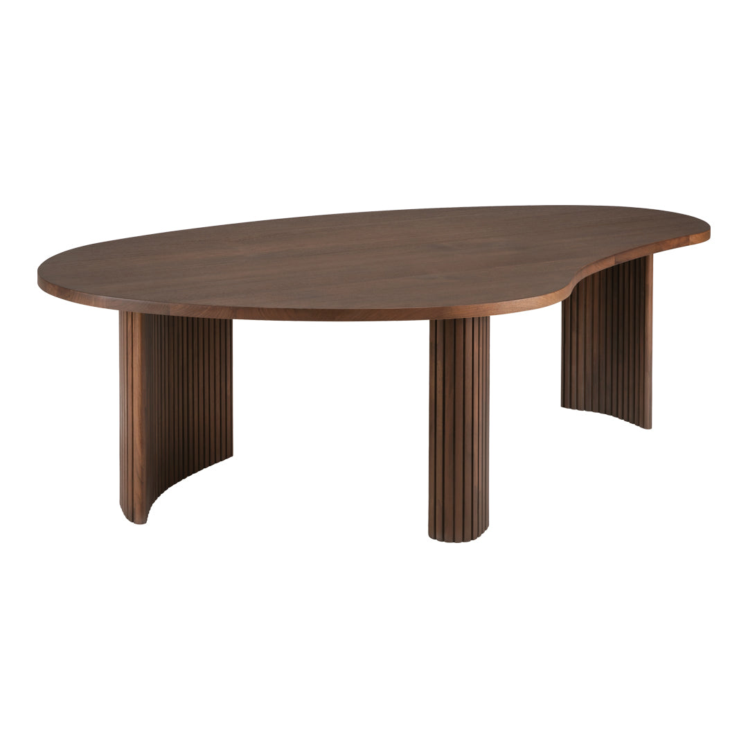 Brown wooden dining table with an organic shape and ribbed legs, featuring a smooth, polished surface.
