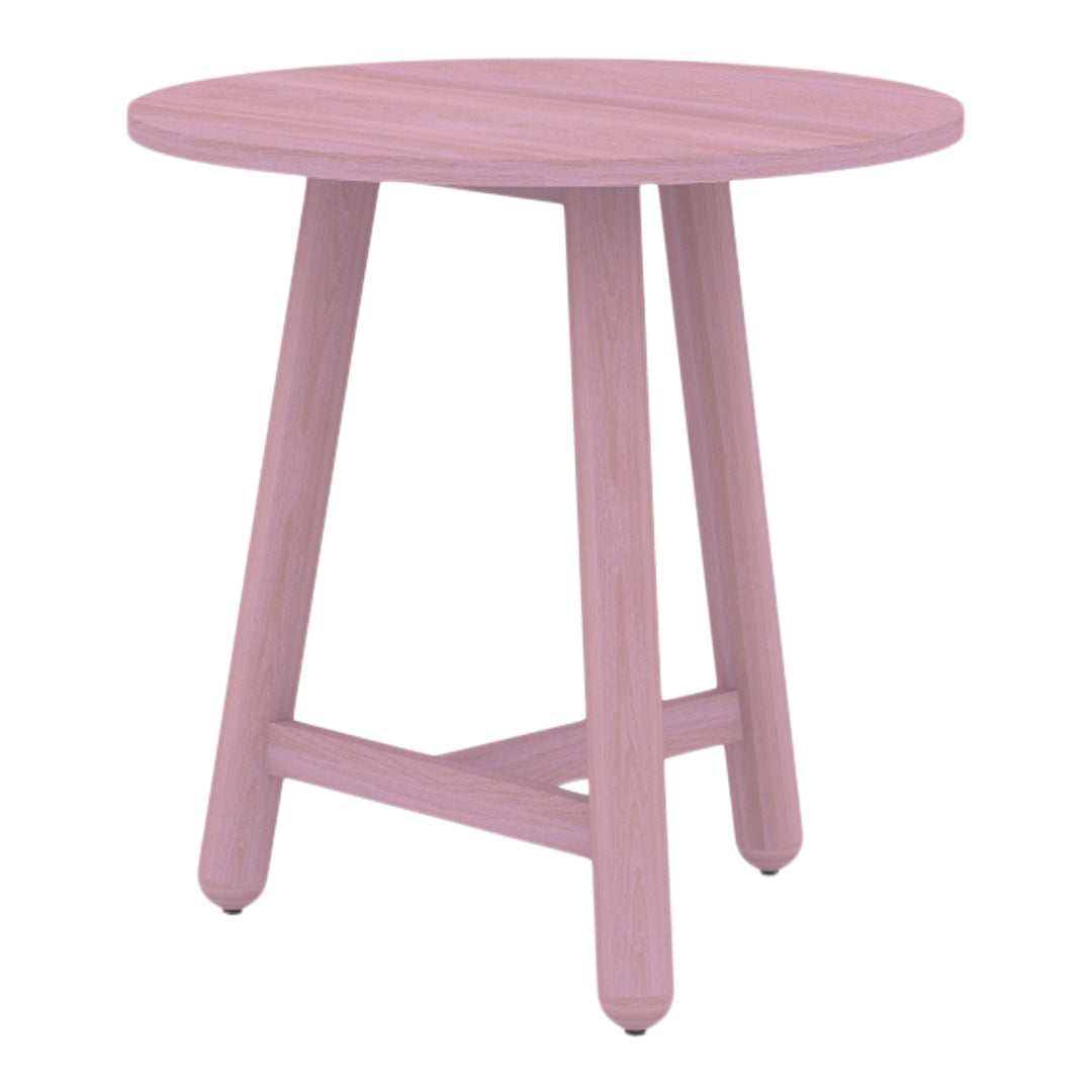 "Round pink side table with a smooth finish and light wood legs, perfect for modern decor."