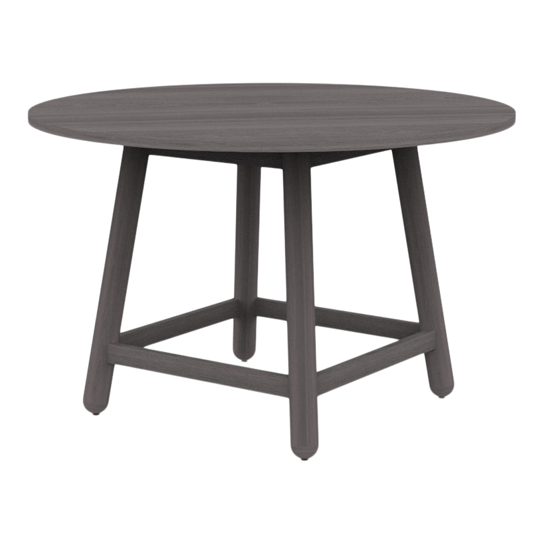 Round grey wooden table with a smooth finish and minimalistic design, featuring four tapered legs for stability.