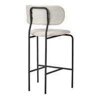 Modern bar stool in neutral beige fabric with minimalist black metal frame. Ideal for contemporary decor.