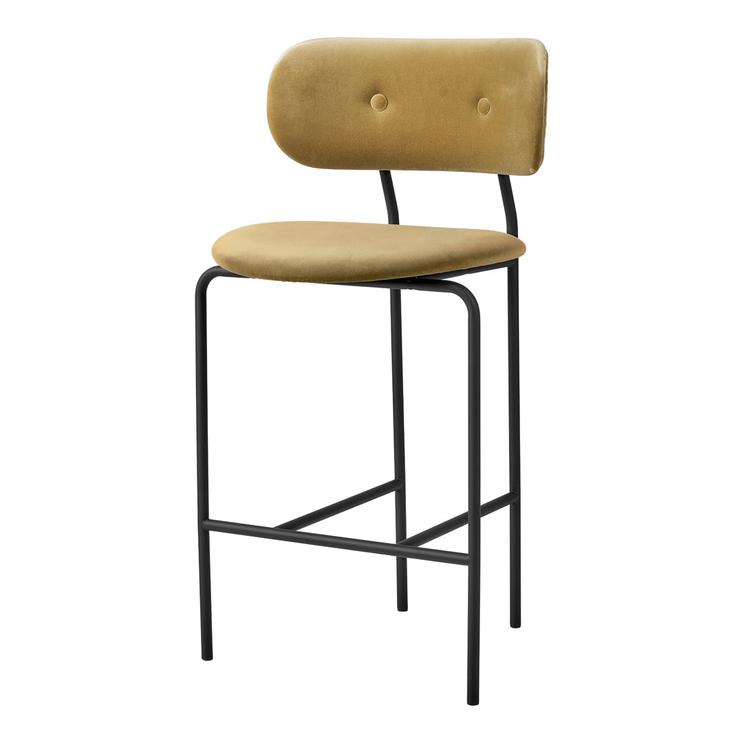 Stylish mustard yellow bar stool with a smooth, padded seat and backrest, featuring a sleek black metal frame.