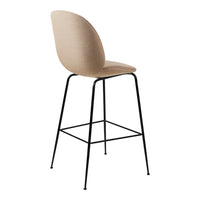 Beige upholstered bar stool with a sleek black metal frame, featuring a minimalist and modern design.