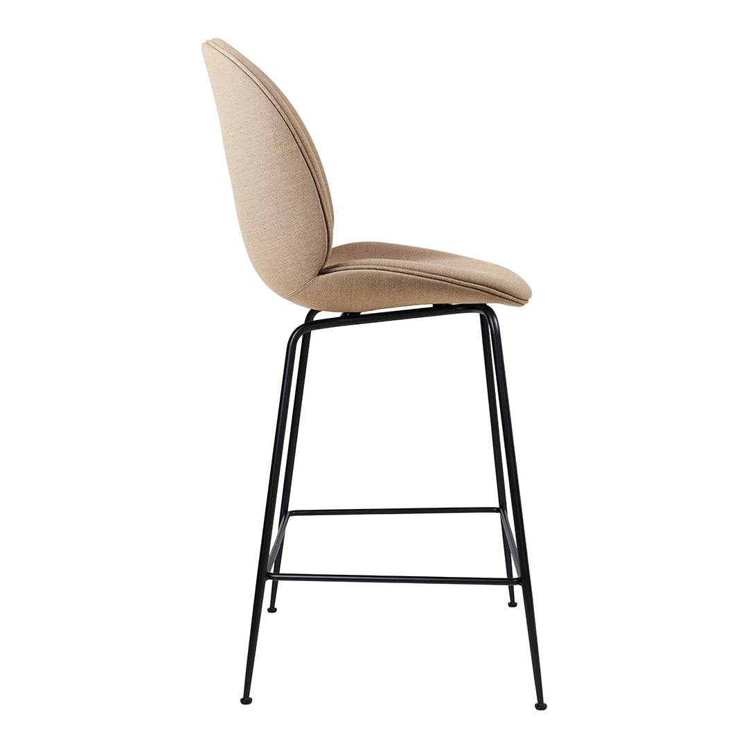 Beige upholstered bar stool with a sleek black metal frame, featuring a smooth, minimalist design.