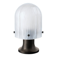 Clear ribbed glass lamp shade with a sleek black base, featuring subtle texture and modern design elements.