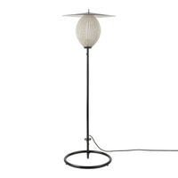 Modern floor lamp with a textured white shade and sleek black metal base, featuring a minimalist design.