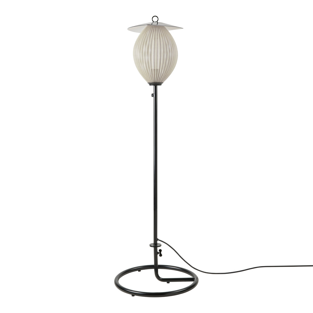 Elegant white ribbed shade on a sleek black metal base, featuring a minimalist and modern design. Perfect for contemporary decor.