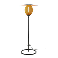 Modern floor lamp with a warm orange shade and sleek black metal base, featuring a unique oval design.
