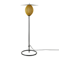 "Modern floor lamp with a textured yellow globe and sleek black metal base, featuring a minimalist design."
