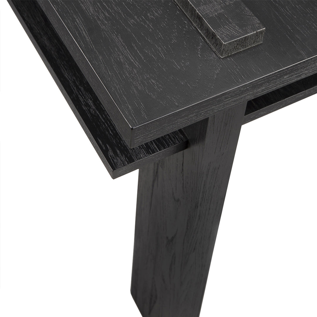 Black wood table with a smooth, matte finish and clean, contemporary lines. Modern and minimalist design.